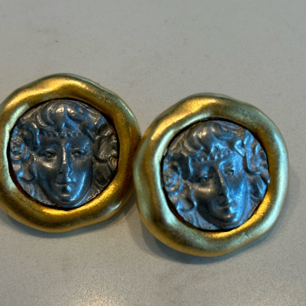 Unique Earrings in Jorge Adeler style , female visage